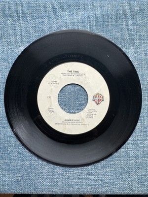 The Time    Jungle Love / Oh, Baby   7  Vinyl 45 US 1984 Warner Bros 7-29181