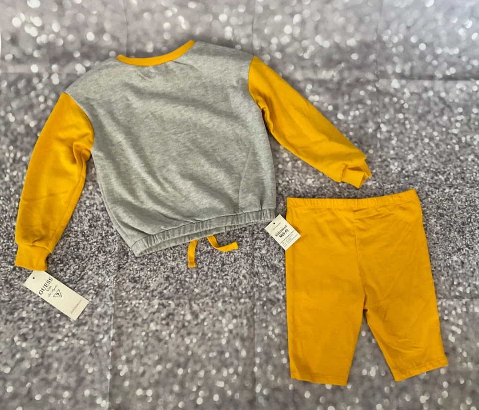 Guess Toddler Girl 2-Piece Grey & Yellow Drawstring Sweatshirt & Bike Shorts Set - Image 4 of 4