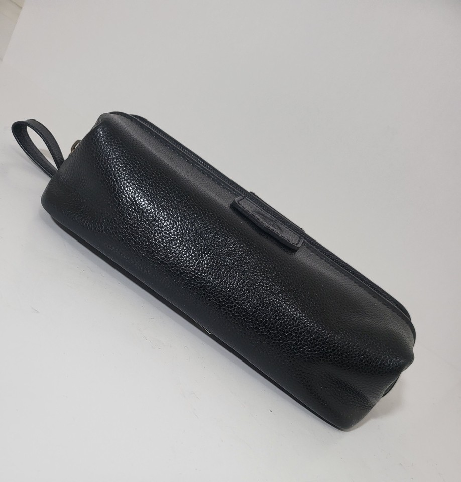 A genuine vintage Dopp black leather toiletry bag — a classic American grooming kit brand that pre-dates every modern 'heritage' clone trying to copy it.