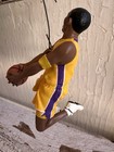 2003 Hallmark Hoop Stars ornament of Kobe Bryant in yellow Lakers uniform holding basketball, purple side stripe.