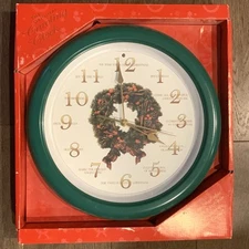 The Original Caroling Wall Clock New Christmas Carols Light Sensor Green Wreath