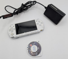 Sony PSP 2003 Slim Console in White. No battery, missing little plastic on side