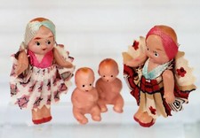 Made in Japan 2 Celluloid 2.5" dressed girl dolls and 2 hard plastic1" Baby Doll