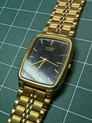 citizen 6031-R09933 watch gold rectangle black face