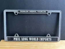 Phil Long World Imports License Plate Frame vintage Colorado Springs Dealership