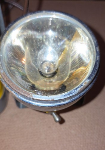 Vintage yellow JUSTRITE Flashlight Lantern No. 1958 with worn silver finish and internal glass bulb holder.