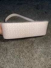 Guess shoulder bag features a sophisticated cream Or Pink Color