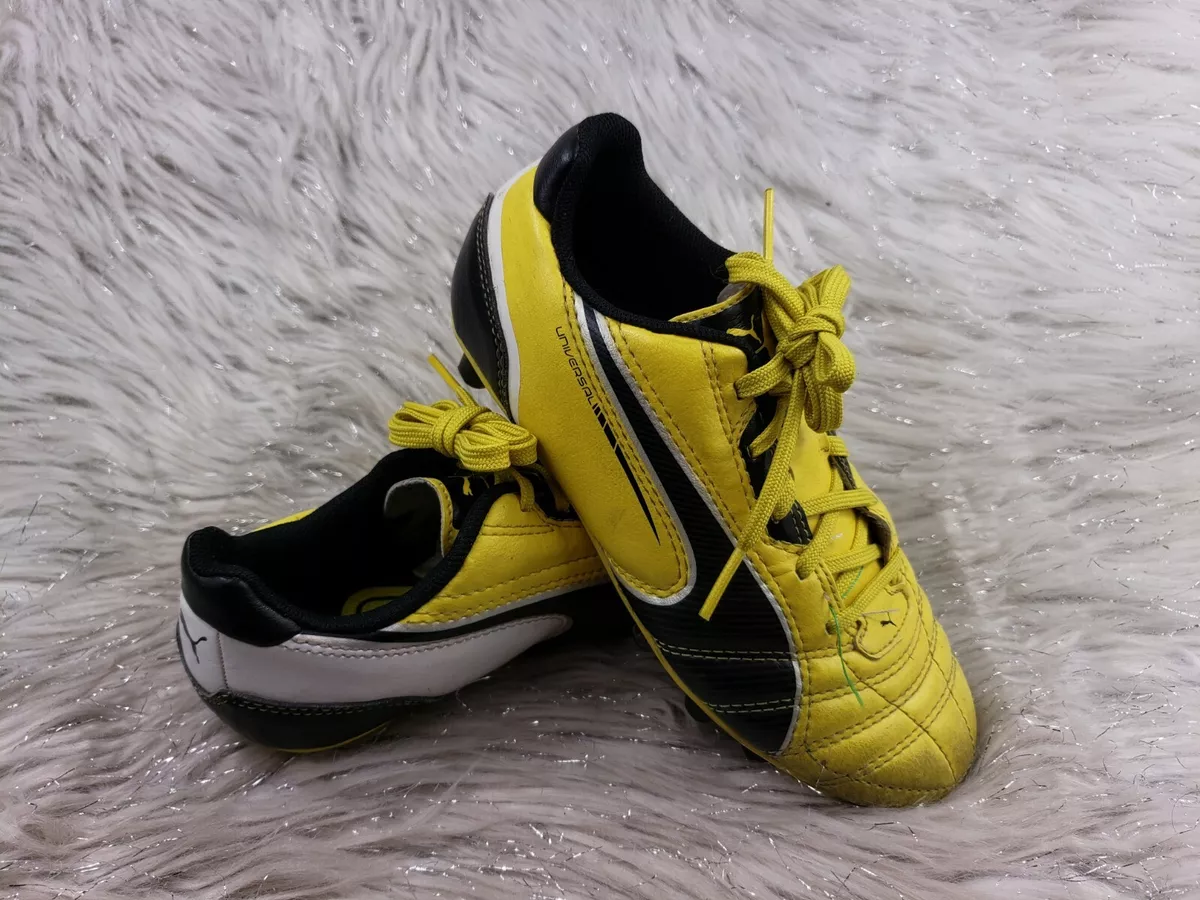 Puma king yellow black top