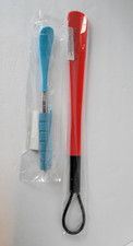Shoe horns one is telesccoping to 28" the other is 19" new plastic red blue