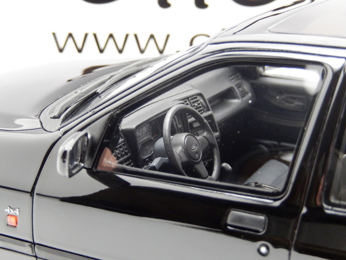 KOVOVÉ a RESIN MODELY | Ford Sierra Cosworth 4x4 (1992) Bílá MCG 1:18