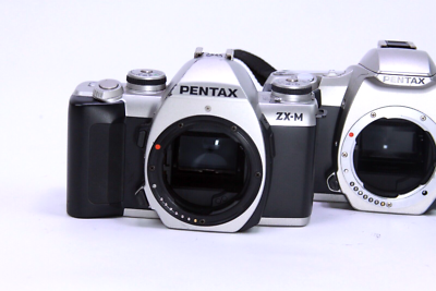 Lot of 3 Pentax ZX-M (2) & zx-7 (1) 35mm Camera bodies - Power on