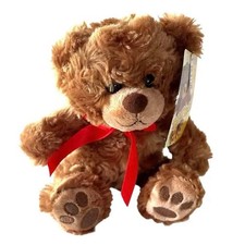 Brown teddy bear red ribbon