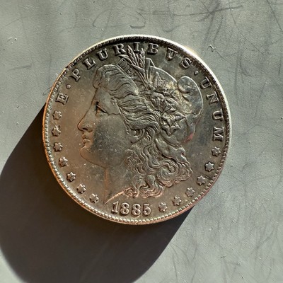 1885-S Morgan Dollar About Uncirculated (small rim nick)