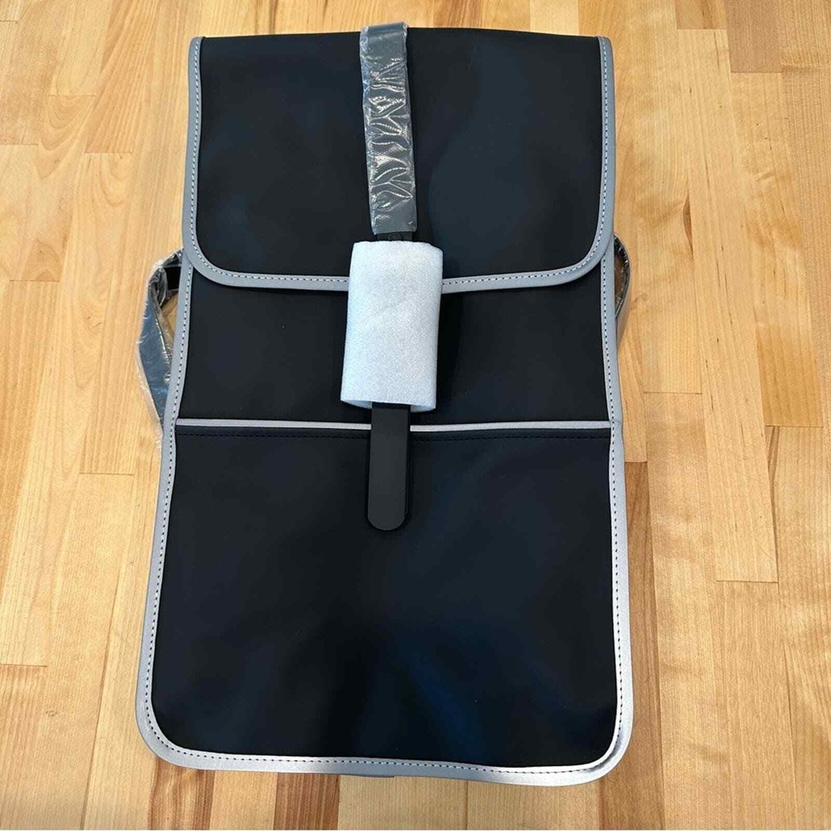 NWT Rains Full-Size Backpack in Black with reflective silver 