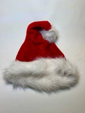 One fluffy adult-sized Santa cap w/ faux fur trim & two oversized red stockings