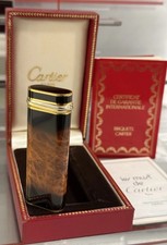 Encendedor Cartier Trinity marrón llama lacado chapado en oro