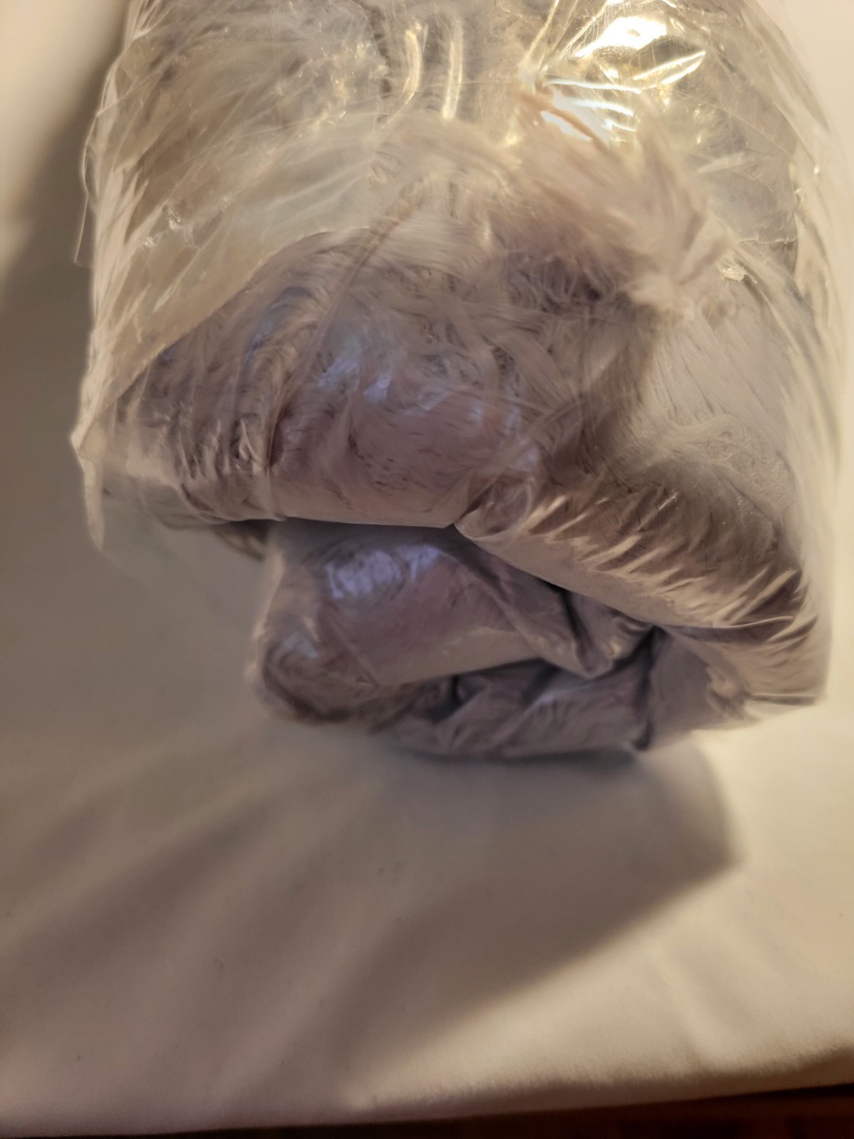 Cozy gray furry round dog bed for small pets