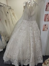 One lot of 50 designer wedding Gowns For 25,000.