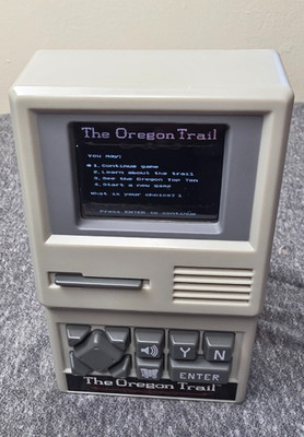 The Oregon Trail Handheld Electronic Game - 2017  #09597 - Sound & Power Tested