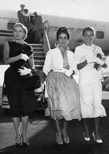Grace Kelly, Elizabeth Taylor, and Laraine Day arriving at the New York Internat