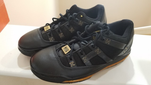 lebron james shoes black and gold