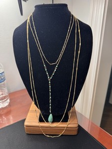 Multi-Stranded Goldtone  Necklace With Turquoise Colored “Y” Pendant.