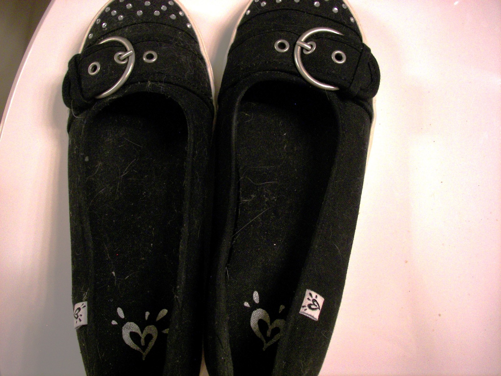 black slip-on slight-heel dress sneakers