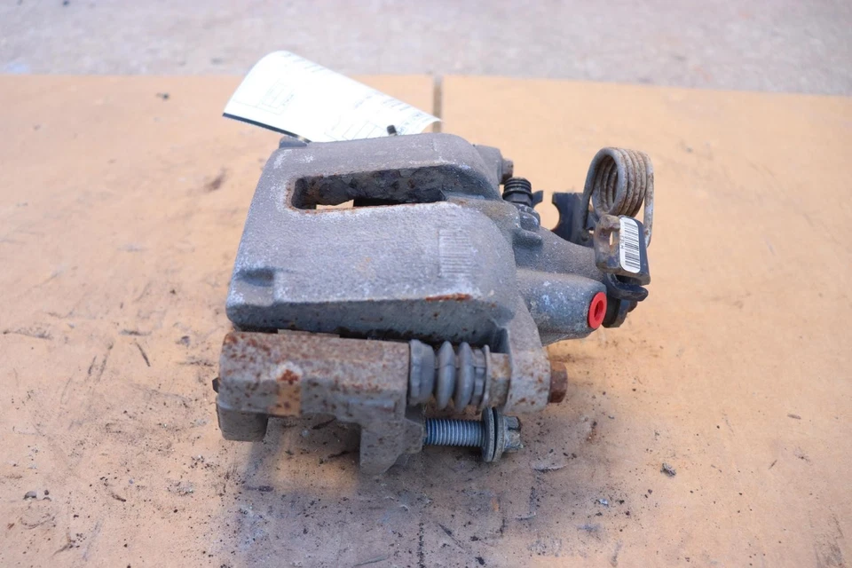 Pinza de freno trasera izquierda Ford Flex 2014-2019 OEM Foto 3 de 4