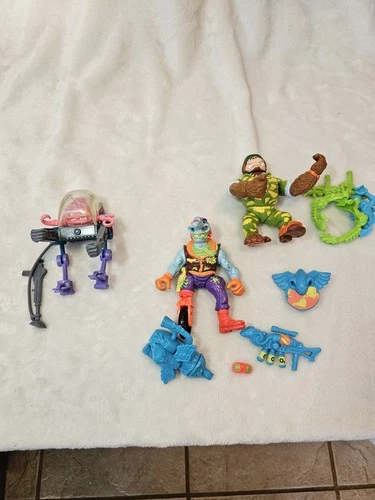 Vintage lot of 3 Teenage Mutant Ninja Turtle figures w/ Weapons Accessories