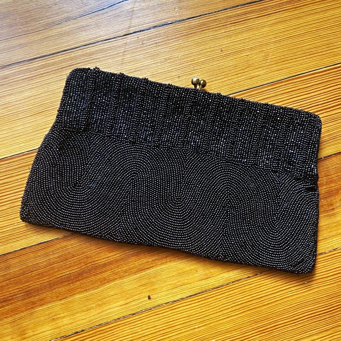 Handmade black beaded evening clutch by Charbet of Belgium with kiss-lock frame