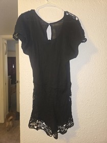 Black lace romper with tie waist and ruffle sleeves