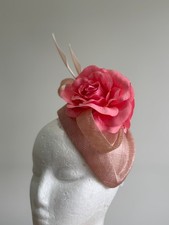 Pink air hostess fascinator with sinamay loops, flowers and arrow feathers