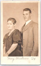 Vintage 1934 Christmas Real Photo Postcard of Couple in Formal Attire