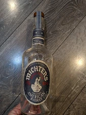 Empty Clear Corked Bottle of Michter's Small Batch Unblended American Whiskey