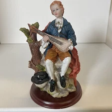 Vintage Resin  Boy Figurine Playing Music by Artmark Wood Base  7.5”figurine