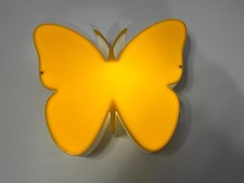 Wall-mounted butterfly-shaped LED light.