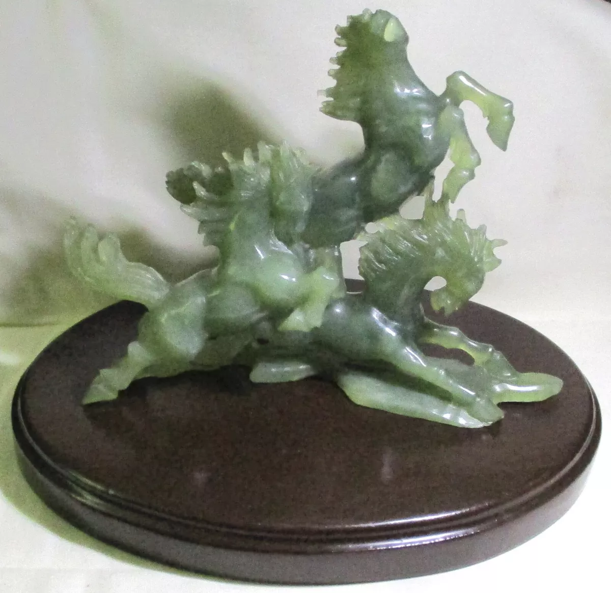 Late Twentieth Century Chinese Green Jade Sculpture Depicting Three Wild Horses