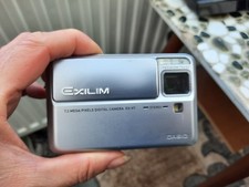 CASIO EXILIM EX-V7 7.2 MP Compact Digital Camera Silver with charging dock