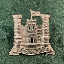 Royal Inniskilling Fusiliers     Cap badge.        ALL.  White metal.  .    Ec25
