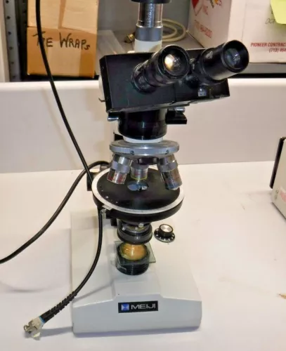 Meiji Microscope we believe its a ML9000  with 4x 10x 40x objectives 2 HW 10X Ey