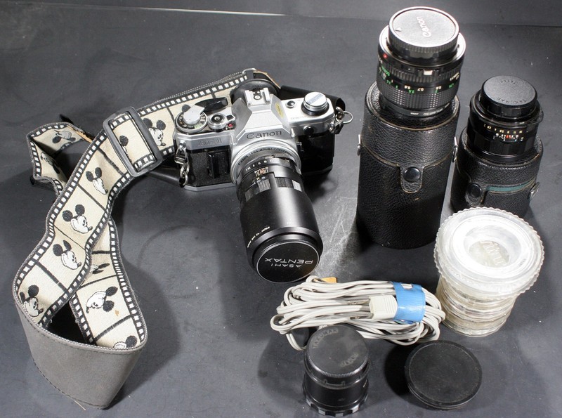 CANON AE-1 film camera w/lenses, bag and much misc