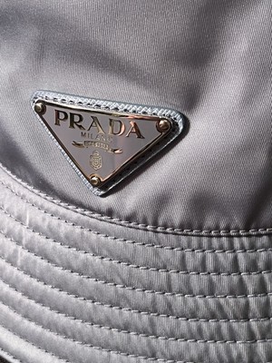 PRADA バケハ シルバー M AUTHENTIC $725 PRADA TRIANGLE METAL EMBLEM AQUA BLUE BUCKET CAP