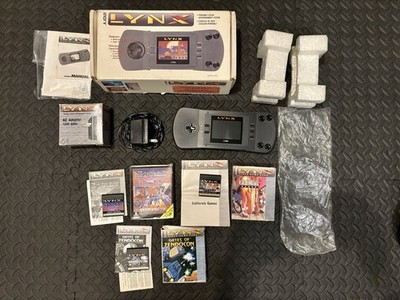 Atari Lynx PAG-0201 In White Box With Manual, AC Adapter and Games In Box.