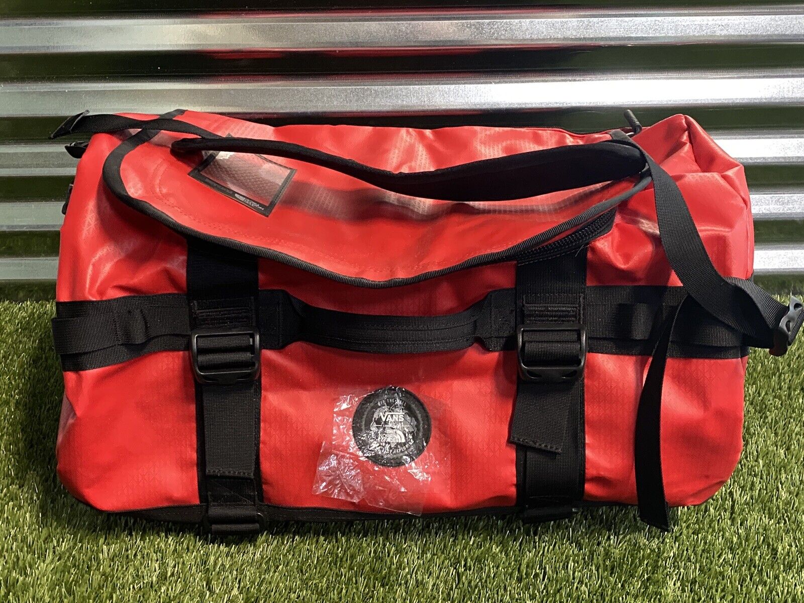 red north face duffel bag