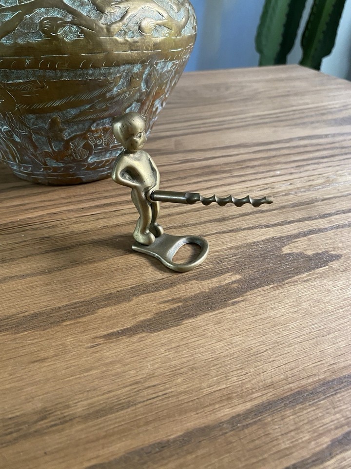 Brass 'Manneken Pis'-style Bruxelles figural corkscrew — a winking nod to Brussels' most famous landmark rendered in functional barware.