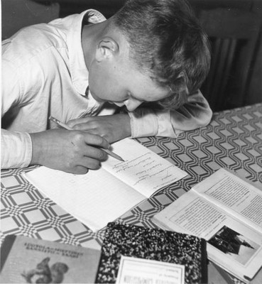 Young Finnish boy Tauno Vierela doing his homework 1950s OLD PHOTO