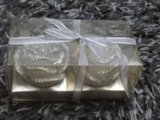 BHS silver glittery petals on white rose shaped candles