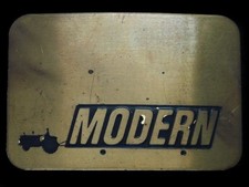 TA03132 VINTAGE 1970s  MODERN TRACTOR  ADVERTISEMENT BELT BUCKLE