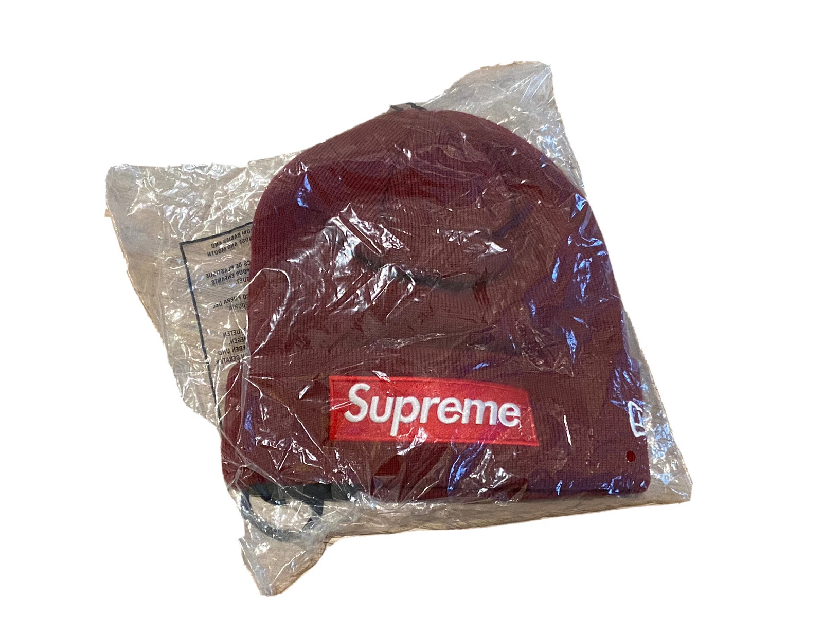 Boîte Supreme New Era logo Beanie Cardinal World Famous Beanie FW22 taille unique neuve