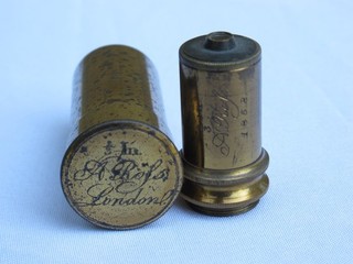 Antique brass microscope objective lens in canister. Andrew Ross. 2/3".